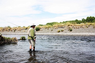 New Zealand fishing guide Grant Petherick in his office, eyeballing this pool on the Tukituki River for trout